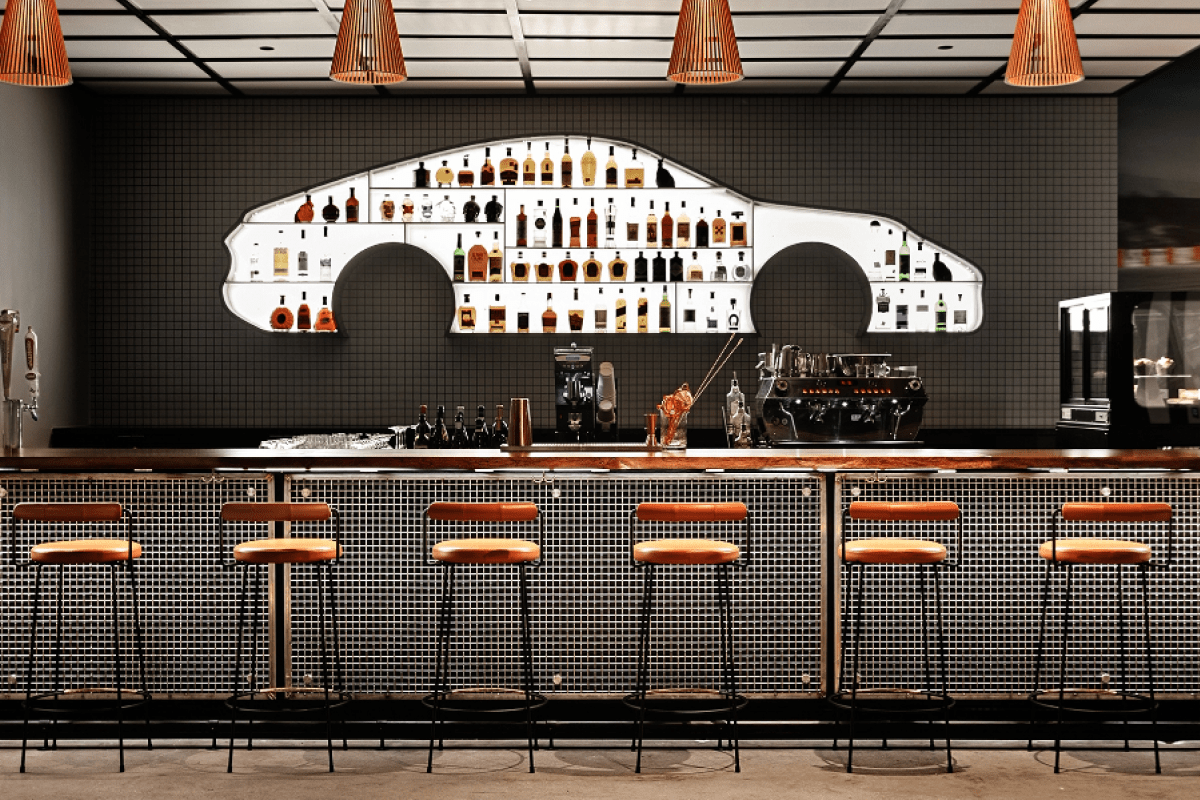 Head-on image of bar with car-shaped shelving