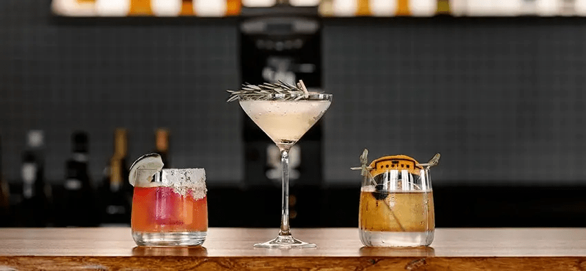 Closeup-up of three cocktails sitting on the bar